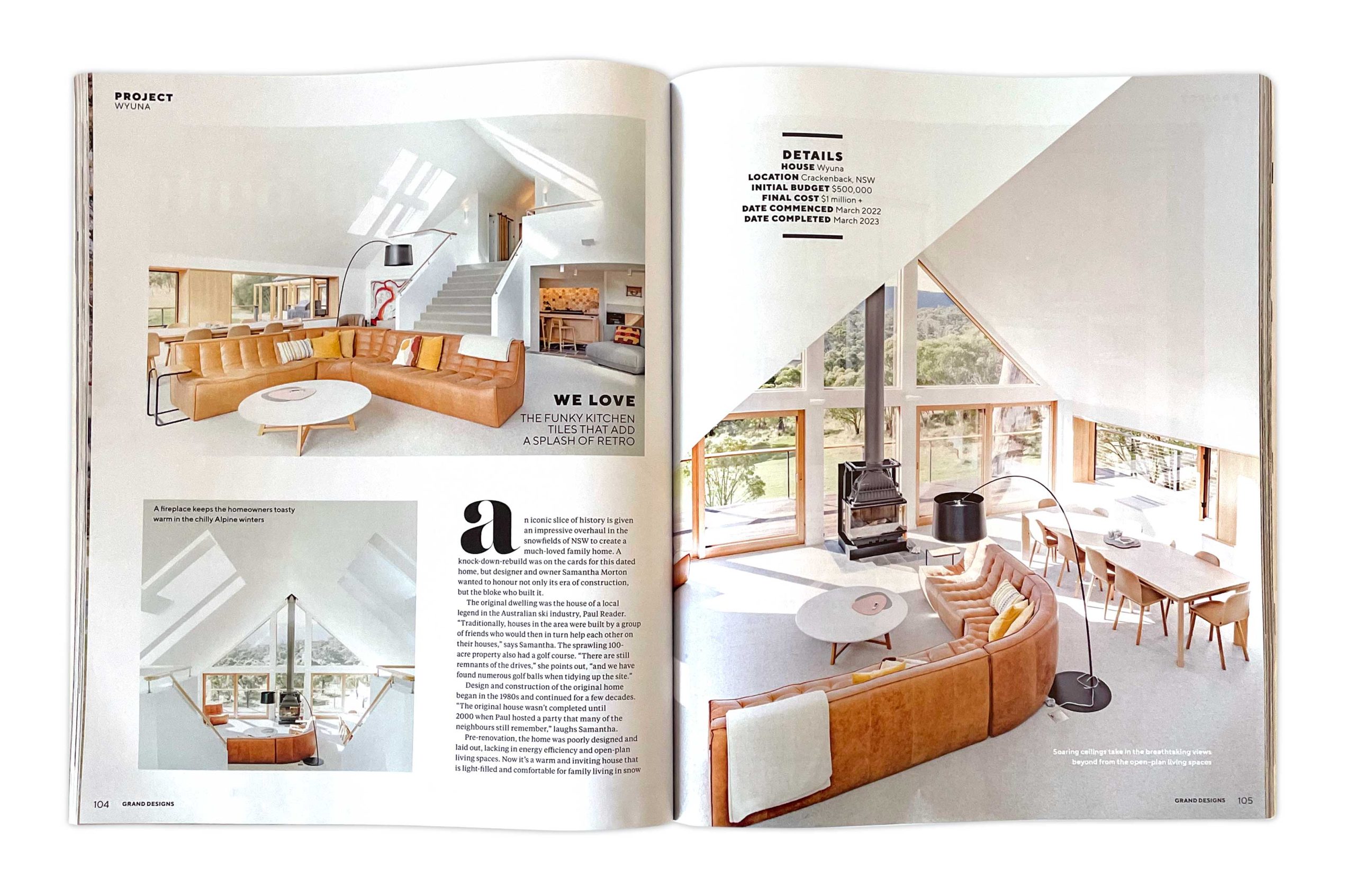 House Wyuna featured in Grand Designs Australia interior spread Grand Designs Australia magazine feature spread showing the open-plan interior of House Wyuna in Crackenback, NSW, with a curved tan leather lounge, timber windows, high vaulted ceilings and alpine views.